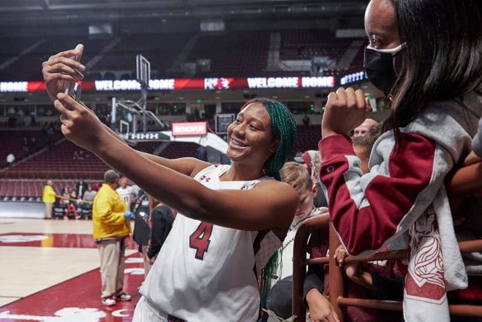 South Carolina star Aliyah Boston takes a selfie with a Gamecocks fan.